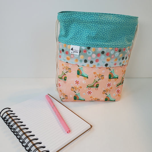 Cute, vintage style organizational bag, in smallest size. Fabric theme is roller skating